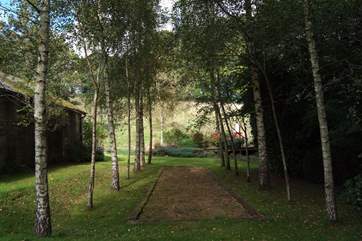 Have a go at boules on this lovely tree-lined court.