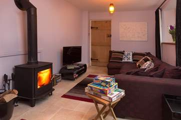 There are two sitting rooms - this one has a wood-burner and TV. There is a lovely stack of DVDs for you to enjoy if you have a wet day.