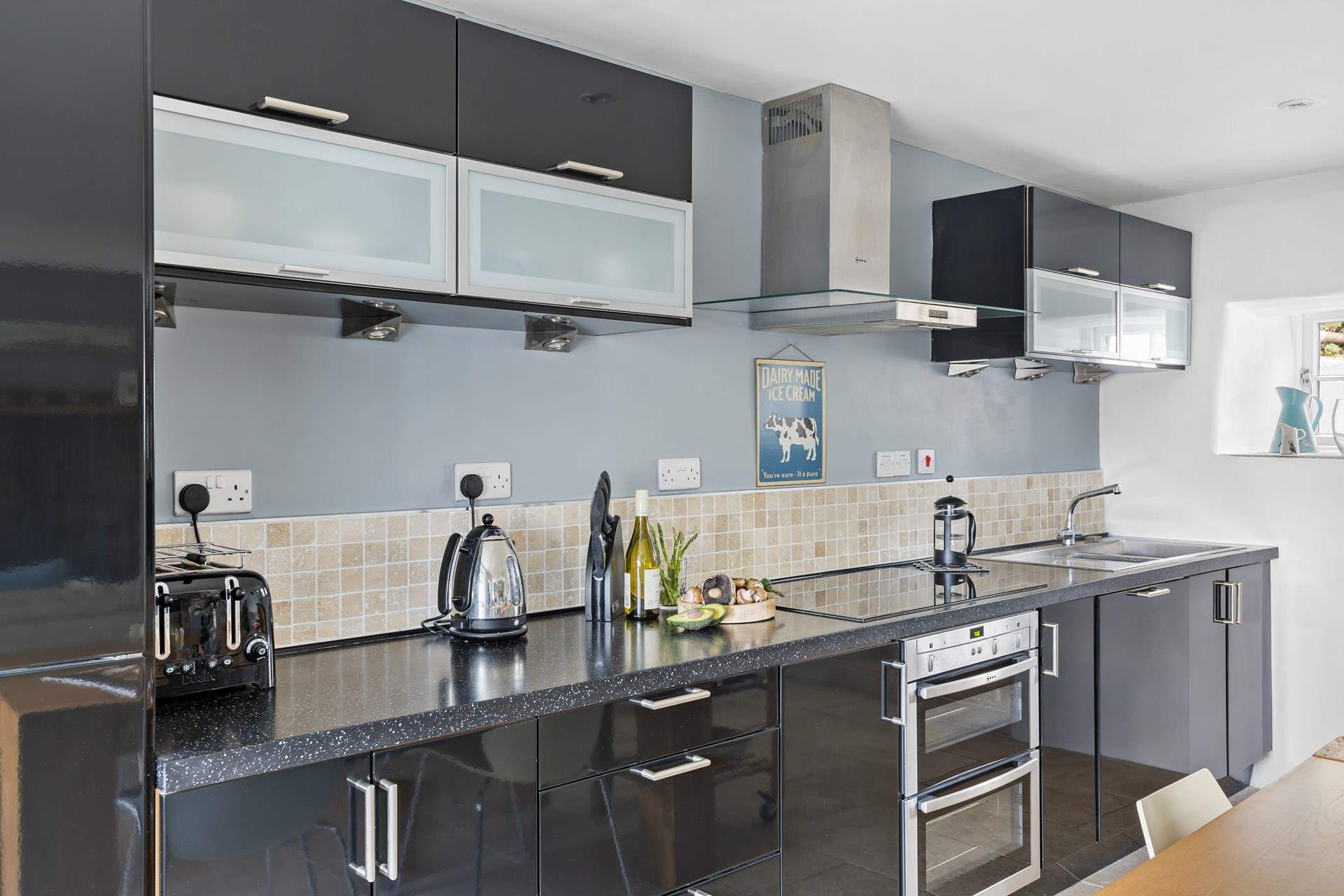 A stylish fully equipped kitchen awaits the chef's arrival.