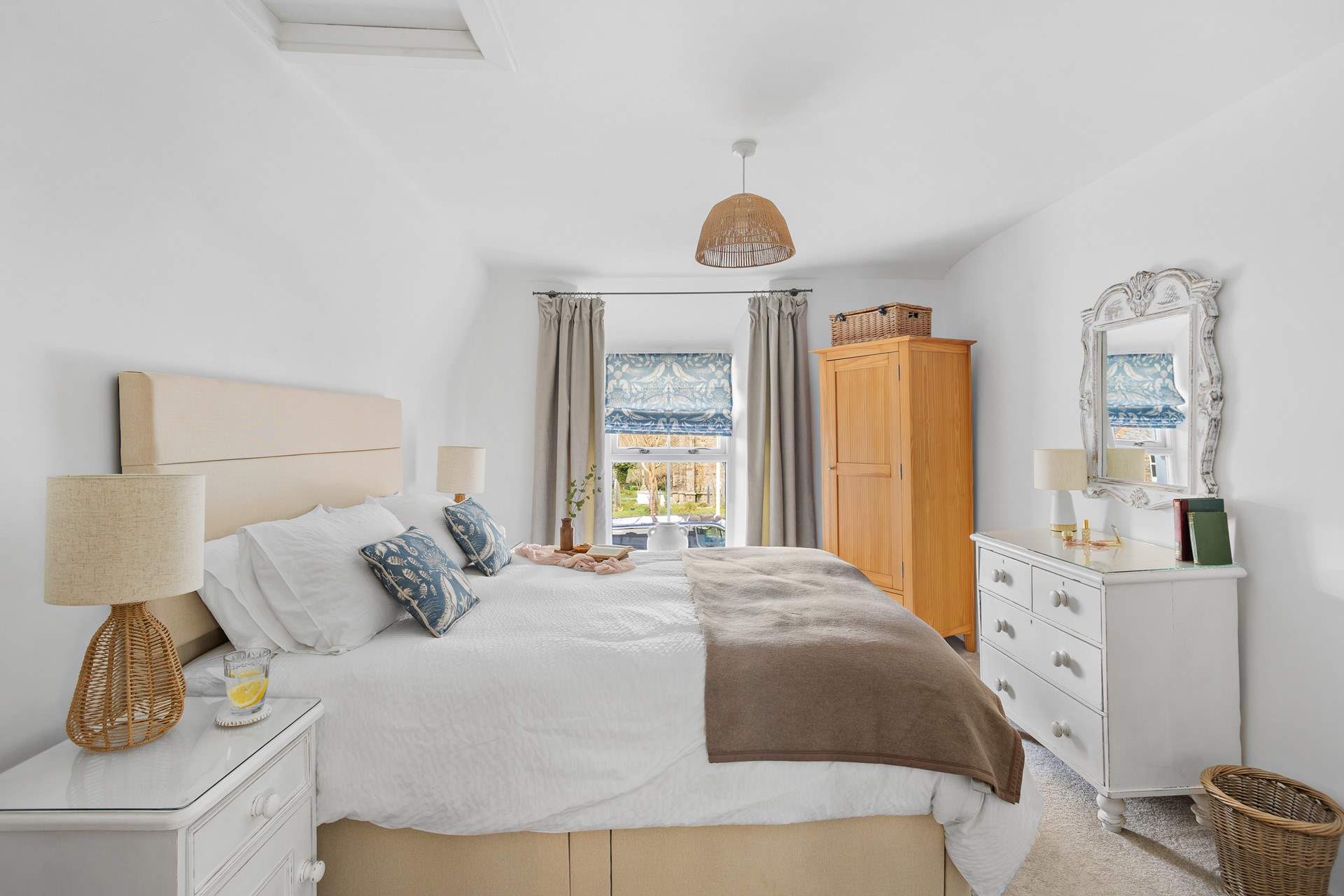 Bedroom 1 is a calming oasis with views out towards the village church.