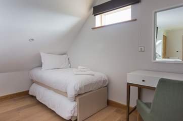 The room adjacent to the master bedroom is where you will find additional sleeping space - a single with a trundle bed underneath, room for two little ones.