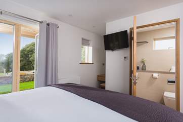 This ground floor bedroom also has an en suite shower-room.