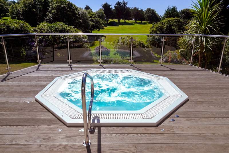 Enjoy a glass of champagne in the outside hot tub at the spa