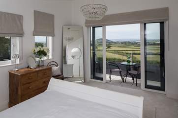 Views from the first floor master bedroom (Bedroom 3) and small balcony.