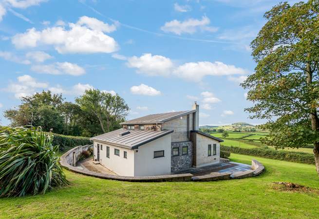 The patio stretches around the whole house.