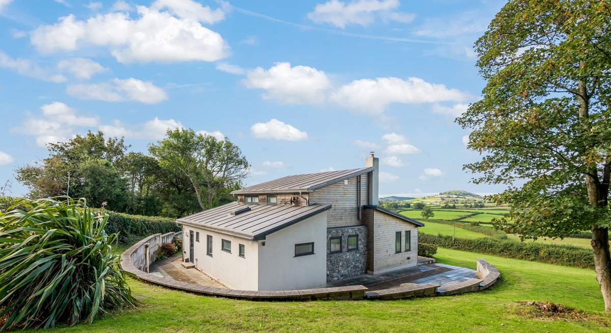 The patio stretches around the whole house.