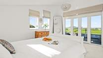 Views from the first floor master bedroom (Bedroom 3) and small balcony.