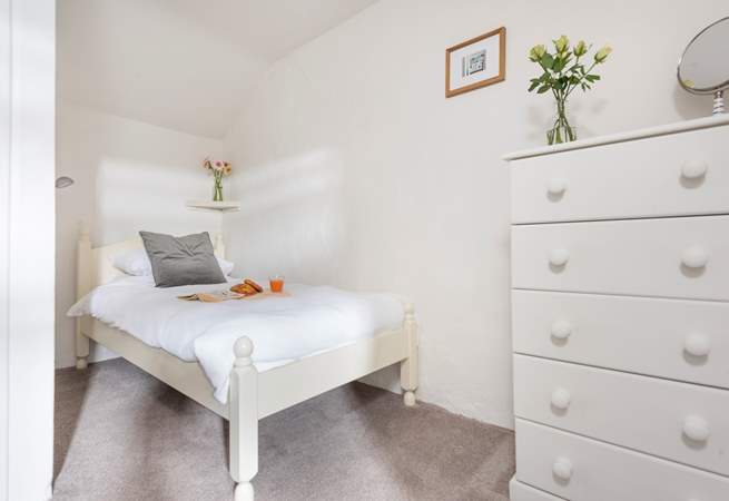 The pretty single bedroom where there is also room for a travel cot.