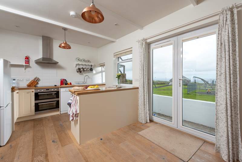 The kitchen/diner has sea views and over looks the village play-area.
