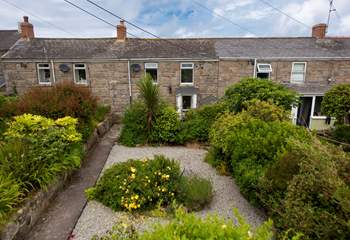 Honeysuckle Cottage is set back with a spacious gravelled front terrace.
