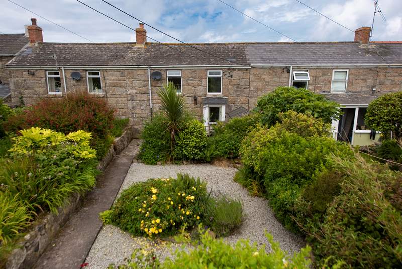 Honeysuckle Cottage is set back with a spacious gravelled front terrace.