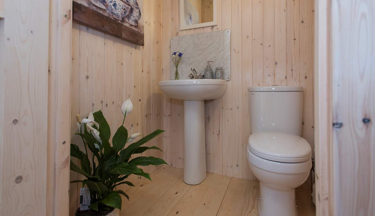 At the back of the tent is the en suite cloakroom.