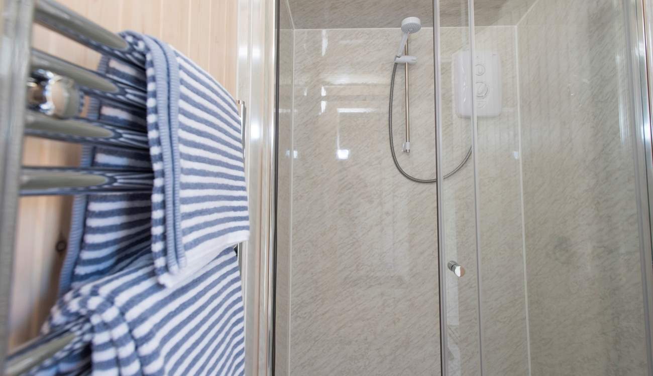 And the en suite shower-room with a double-size shower and heated towel rail.