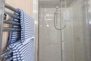 And the en suite shower-room with a double-size shower and heated towel rail.