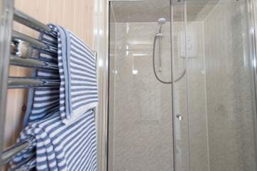 And the en suite shower-room with a double-size shower and heated towel rail.
