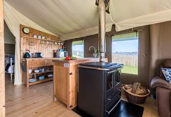 The kitchen-area is fully equipped and includes a  four ring hob, fridge/freezer, microwave, toaster and kettle! There is also the log-fired range to cook on.