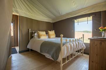 One of the bedrooms at the back of the tent, this one has a king-size bed.