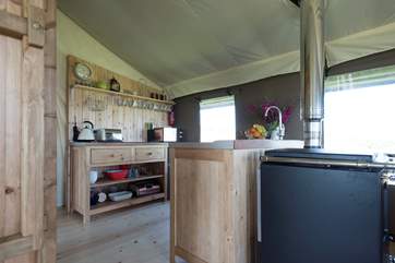 The kitchen-area is well-equipped including a fridge/freezer, four ring hob, microwave, toaster and kettle! The log-fired range can also be used for cooking too.