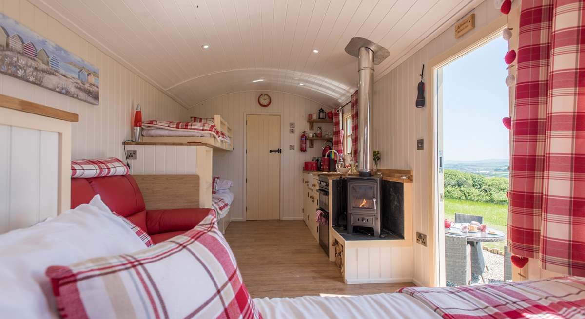 There's a king-size double bed, bunk-beds, kitchen area and en suite shower-room too, perfect for families! 