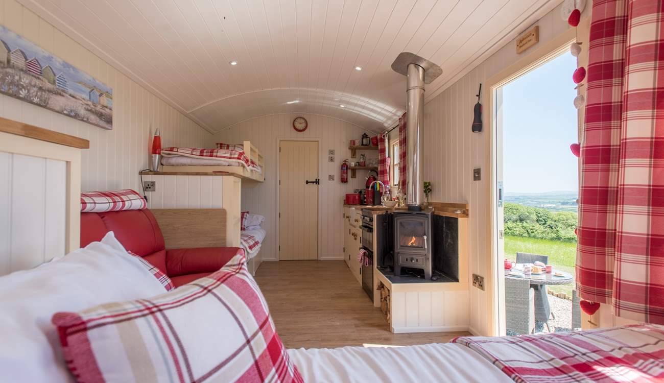There's a king-size double bed, bunk-beds, kitchen area and en suite shower-room too, perfect for families! 