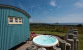 The hot tub sits behind the fence for privacy and shelter and, just like the hut, looks straight out to sea. - Thumbnail Image