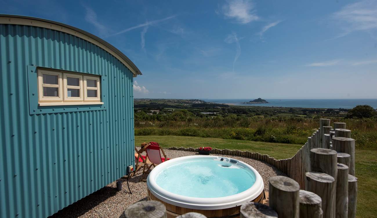 The hot tub sits behind the fence for privacy and shelter and, just like the hut, looks straight out to sea.