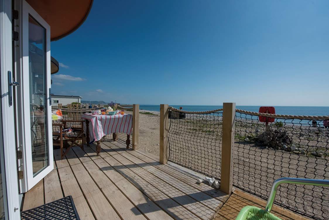 Relax and dine al fresco on your decking with the sound of gentle waves.