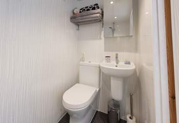 The wet-room has an electric shower, fully flushing WC, wash-basin and underfloor heating.