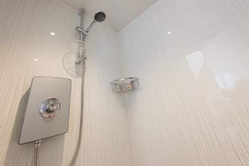 The wet-room has an electric shower, and cosy underfloor heating.