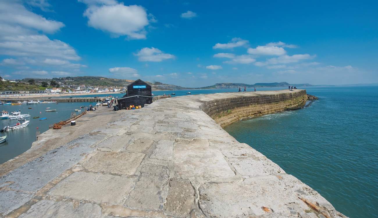 The iconic Cobb, with views across to Golden Cap, is just a five minute walk from The Chalet on the Beach