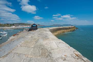 The iconic Cobb, with views across to Golden Cap, just a five minute walk from The Chalet on the Beach