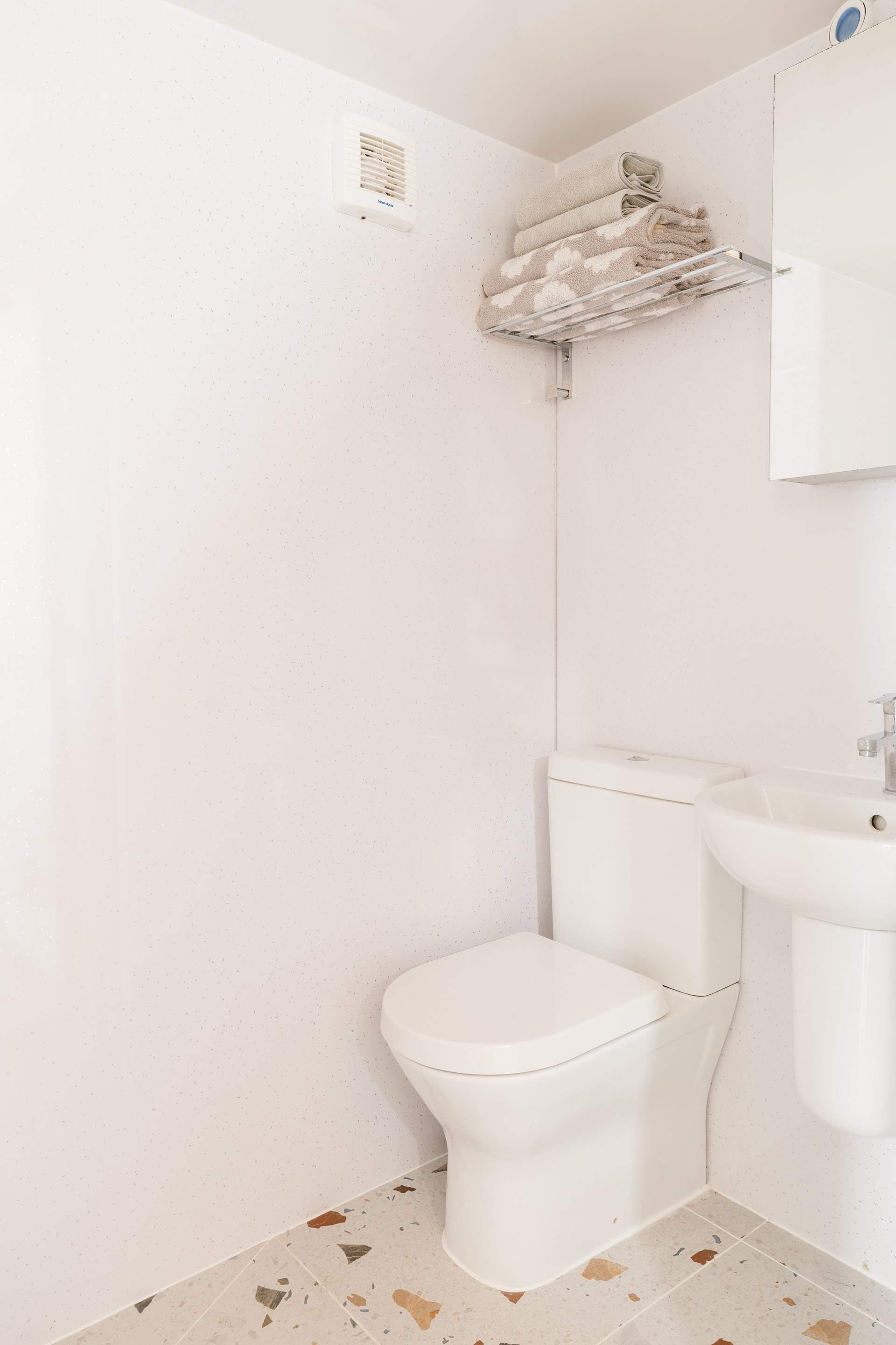 The modern wet room is just the spot to refresh salt-kissed skin. 