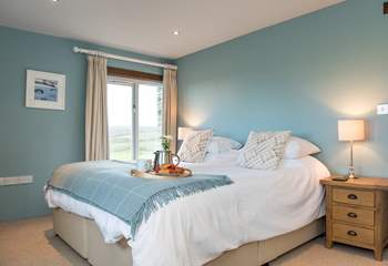 Bedroom three is decorated in calming shades of blue and also has an en suite.