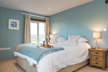 Bedroom 4 is decorated in a calming shades of blue and also has an en-suite