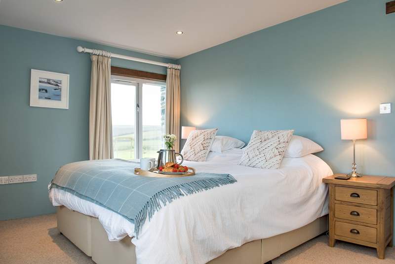 Bedroom three is decorated in calming shades of blue and also has an en suite.
