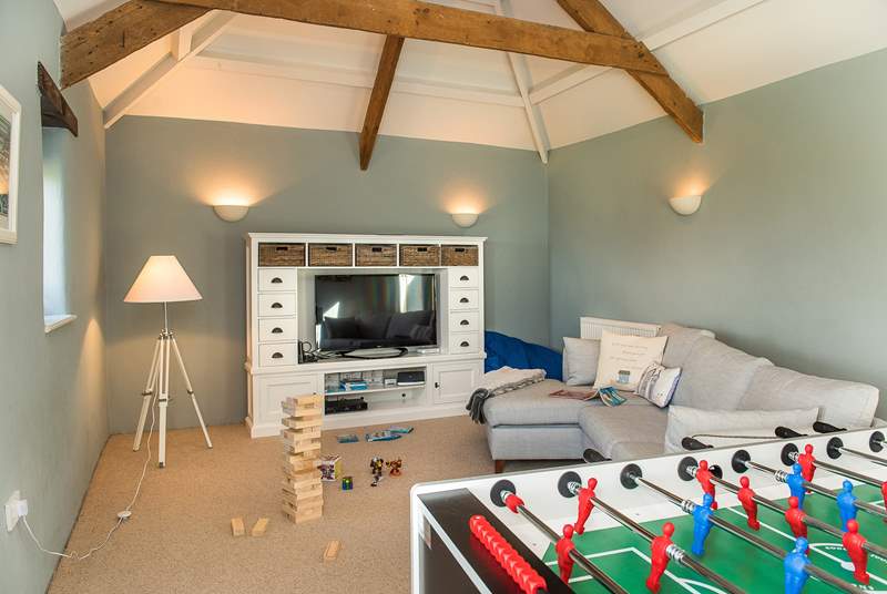 The second sitting-room has plenty of games to keep everyone entertained.