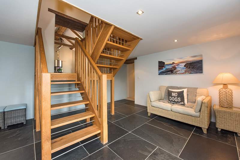 The open tread staircase leads off from the dining-area.