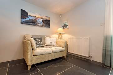 At the far end of the kitchen/dining-room, is a place to sit quietly and relax.