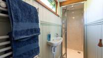 The en suite shower-room has everything you need for freshening up. 