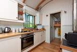 The kitchen includes a electric oven, gas hob, kettle and fridge (with ice-box).