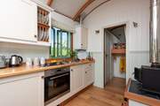 The kitchen includes a electric oven, gas hob, kettle and fridge (with ice-box).