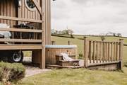 The bubbling hot tub is tucked away to the side of the hideaway, the perfect spot for star-lit evenings.