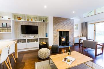 In the cooler months you won't need the wood-burner for heat but it gives you a warm and cosy glow.