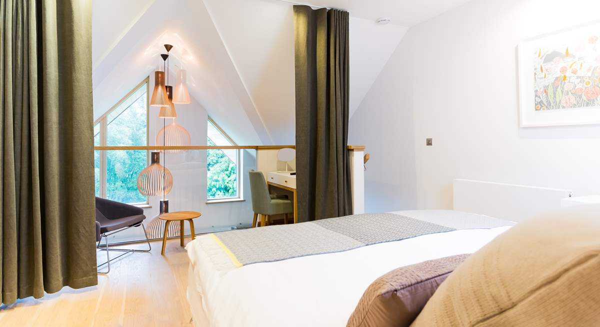 The galleried master bedroom on the top floor overlooks the living space on the first floor. There is a lovely dressing-room next door and an en suite shower-room.(Bedroom 3).