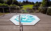 Enjoy a glass of champagne in the outside hot tub at the spa - Thumbnail Image