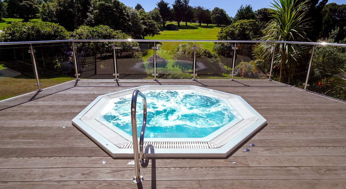 Enjoy a glass of champagne in the outside hot tub at the spa