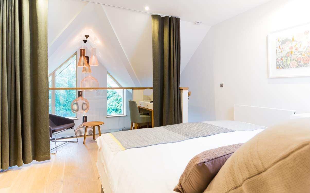 The galleried master bedroom is on the top floor.