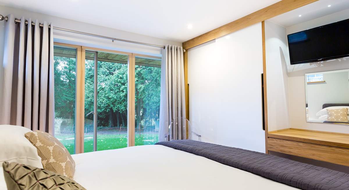 This is a ground floor bedroom, there is a pathway available to hotel guests to the right of the lawn area that leads to the private foreshore. 