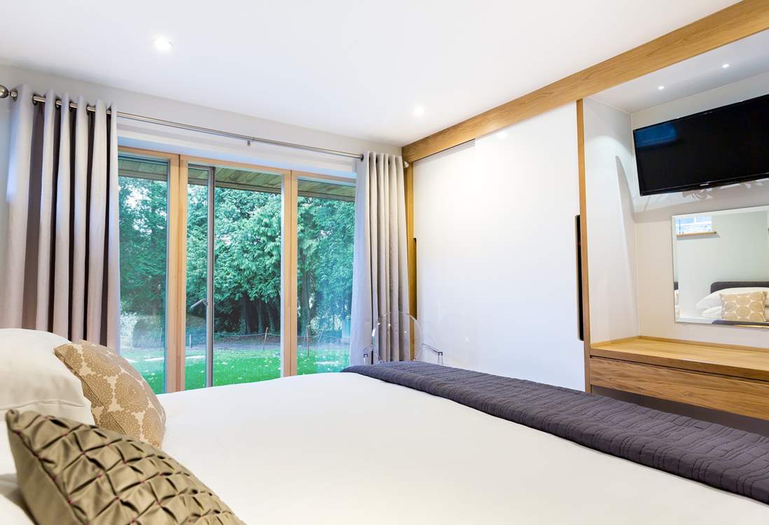 This is a ground floor bedroom, there is a pathway available to hotel guests to the right of the lawn area that leads to the private foreshore.