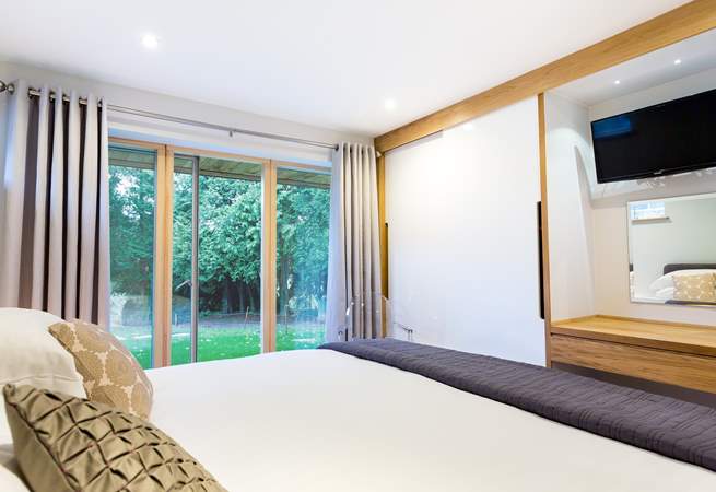 This is a ground floor bedroom, there is a pathway available to hotel guests to the right of the lawn area that leads to the private foreshore. 